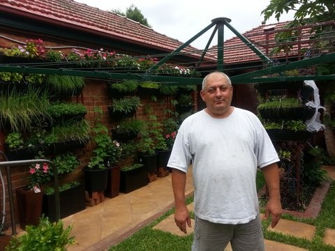 Peter Pannys with his vertical garden aquaponics system.